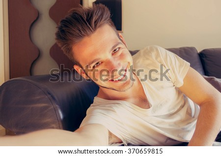 Guy takes a selfie on his sofa - caucasian people - people, technology and lifestyle concept