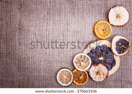 burlap background dried fruits apple orange