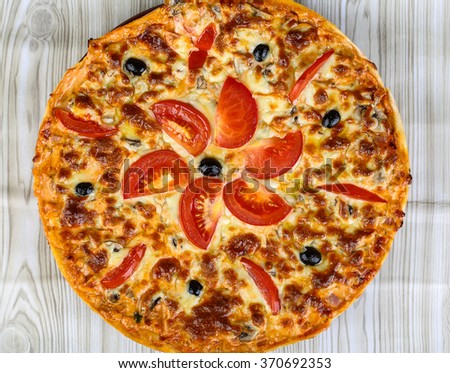 Italian homemade pizza with tomato, cheese and olives