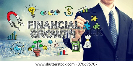  Businessman drawing Financial Growth concept above the city