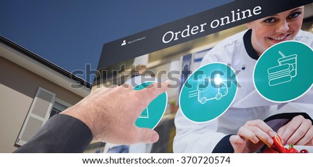 Businessman pointing with his finger against house