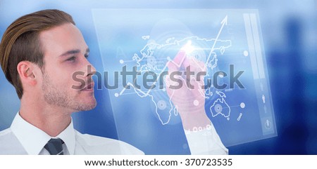 Concentrated businessman pointing with his finger against global business interface