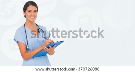 Smiling nurse writing against beige