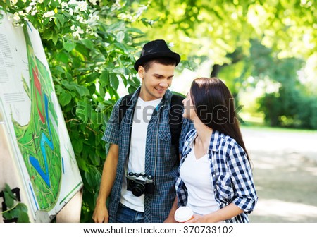 Young couple exploring the park's map.