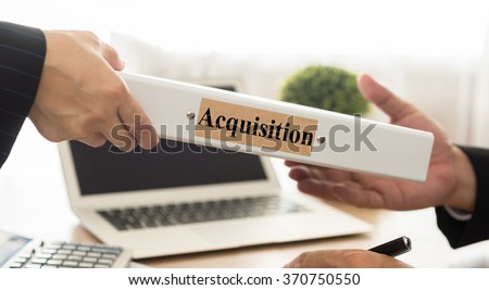 Secretary sends the acquisition document to the manager. selective focus. Acquisitions concept. Royalty-Free Stock Photo #370750550