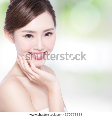 Beautiful Skin care woman Face smile to you with nature green background. asian Beauty