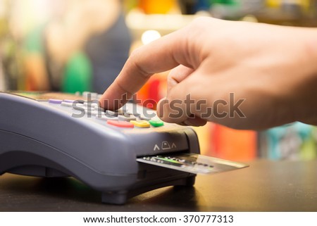 Credit Card Payment, Buy And Sell Products & Service With Clothing Store In Background Royalty-Free Stock Photo #370777313