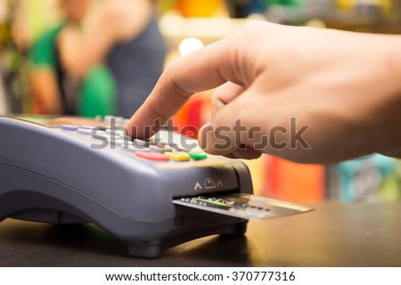 Credit Card Payment, Buy And Sell Products & Service With Clothing Store In Background Royalty-Free Stock Photo #370777316