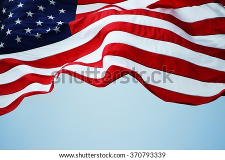 An American flag flowing in the wind.