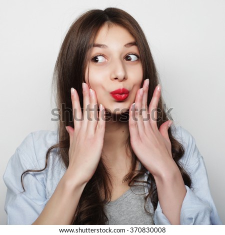 Beautiful young surprised woman.