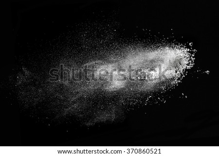 White powder explosion isolated on black background Royalty-Free Stock Photo #370860521