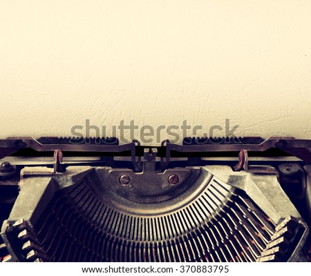 close up image of typewriter with paper sheet. copy space for your text. retro filtered  Royalty-Free Stock Photo #370883795