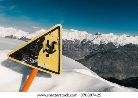 warning sign high in the mountains