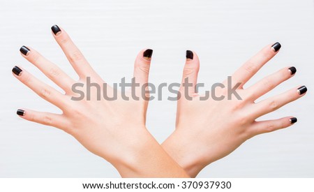 gesture and body parts concept - two woman hands waving hands