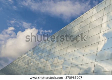 Building and sky. Blue white background.