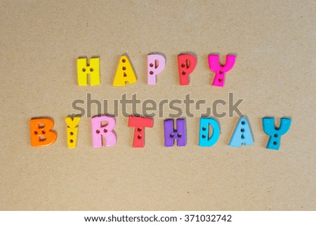 Colourful Letters "Happy Birthday" isolated on a recycle kraft board cover