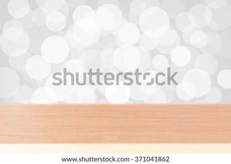 Wood table top on white bokeh abstract background