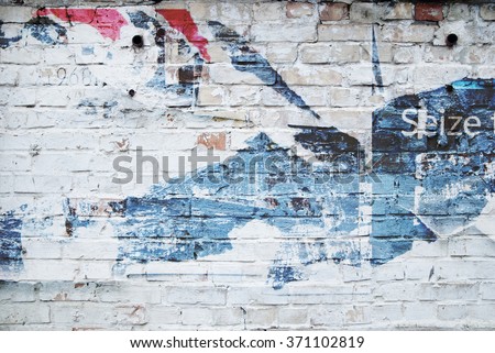 white brick wall and ripped street poster Royalty-Free Stock Photo #371102819