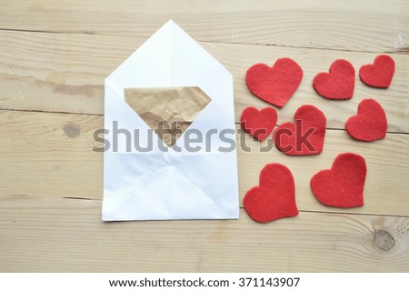 Valentine's Day.love concept, love confession.Happy valentine's day background with hearts.Envelope with a Heart Shapes.Love letter on a wooden background