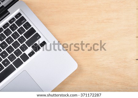 Laptop on wooden table with copy space area