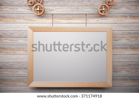 Blank wooden steampunk picture frame on wooden wall, mock up