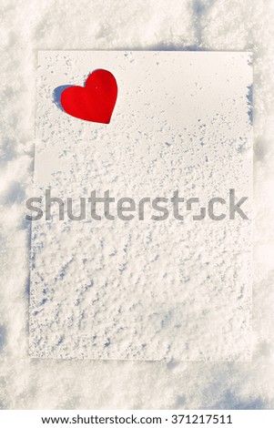 Red heart on white paper background
