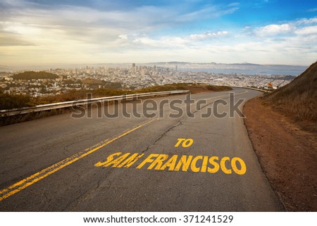 Road going from hill to downtown of San Francisco city.