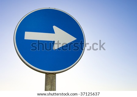 one way signal with blue sky
