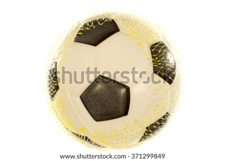 Toy football in mesh isolated on white background