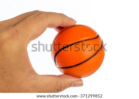 Toy basketball on hand isolated on white background