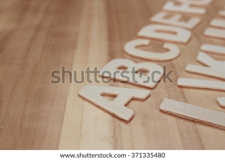 Wooden ABC letter alphabet on the wooden background
