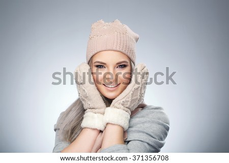 beautiful girl in a cap and a sweater