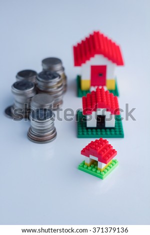 houses and coin tower on white floor