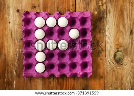 A letter H from the eggs in paper tray for food or nutrition concept