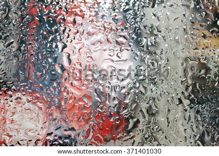 Water and rain drops on the glass. Abstract view background. Drops on glass after rain