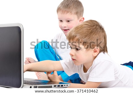 Two children looking on laptop screen isolated on white background