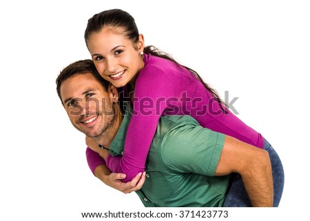 Smart man giving piggy back to his girlfriend on white screen