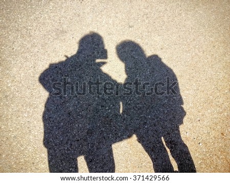 Shadow of a couple taking selfie 