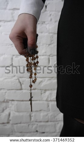 Rosary in hand