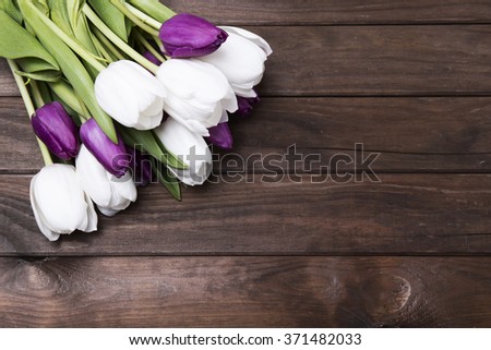 beautiful, fresh tulips on wooden background