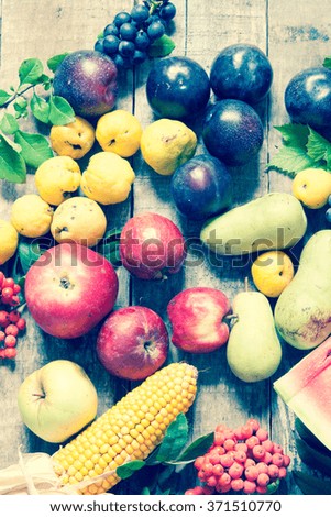 Fruits on a wooden background/toned photo