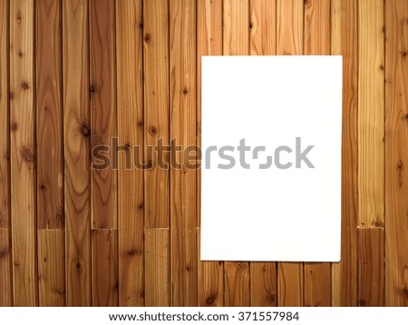 empty white poster hang on wooden wall