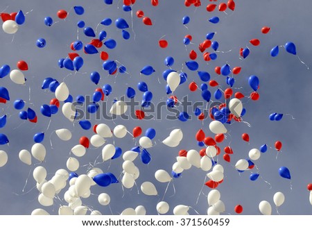 Many colorful balloons flying in the air