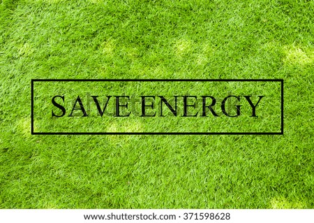 save energy wording on the green grass background