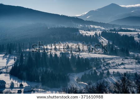 top view of a mountain village. natural winter background. vintage toned picture