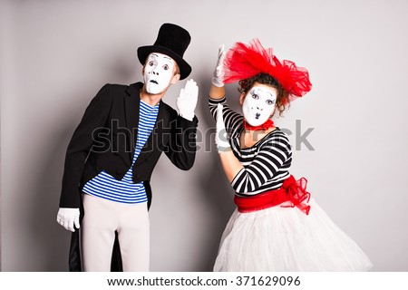 Street artists performing, Two mimes man and  woman in april fools day Royalty-Free Stock Photo #371629096