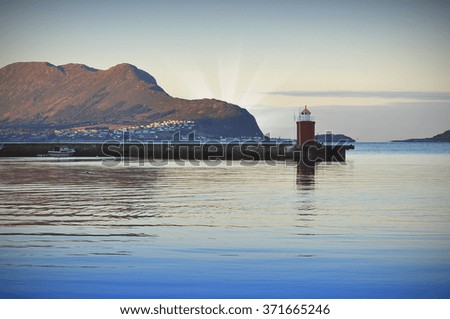 Old lighthouse on sea coast in Alesund - Norway - Toned picture