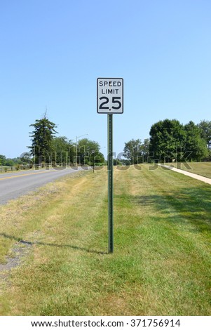 Speed limit sign 25 in field golf course