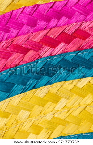 Abstract colorful background of woven straw.