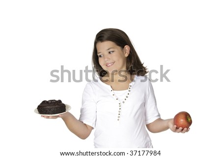 Cute Caucasian girl trying to make a decision between eating healthy or not